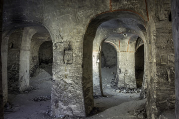 Abandoned chalky underground cave church.