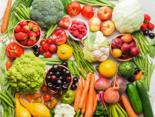 Summer fruits vegetables berries background, apples cherries peaches strawberries cabbage broccoli cauliflower squash tomatoes carrots spring onions beetroot, copy space, top view, selective focus