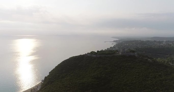 Aerial view of a seaside beautiful village with calm sea on a sunny day.