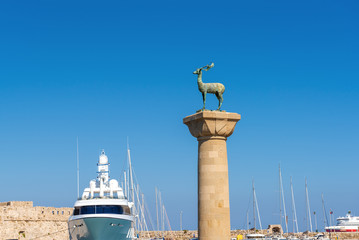 Bronze deer statue in Mandraki harbor of Rhodes town. Rhodes island, Greece