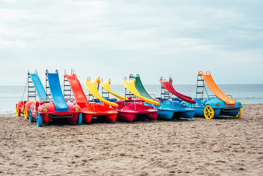 colorful Pedalos on the beach sand