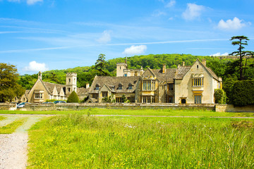 English estate in front of a wooded hill
