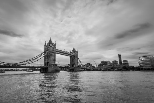 Wide-angle view of the Tower Bridge in London, UK in monochrome. Black and white photography.