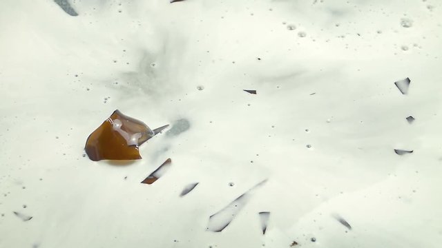 Beer Bottle Breaks On Ground Slow Motion