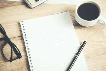 notepad with coffee and calculator
