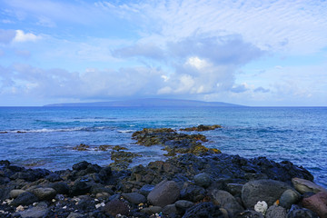 View of black lava rock and blue ocean at the Ahihi-Kinau Natural Area Reserve, on the West shore of Maui south of Wailea and Makena, Hawaii