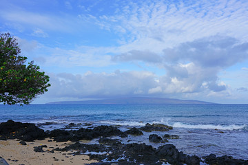 View of black lava rock and blue ocean at the Ahihi-Kinau Natural Area Reserve, on the West shore of Maui south of Wailea and Makena, Hawaii