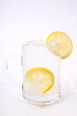 Glass of lemon juice isolated on white background