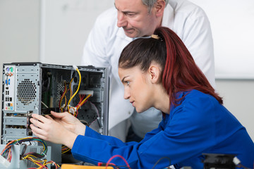 female technician working with transistor