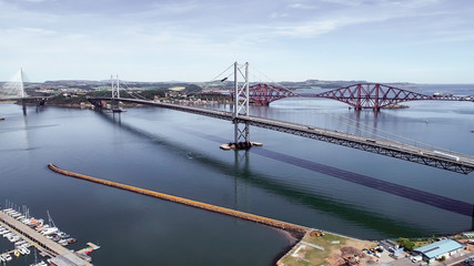 Aerial image looking over the marina at South Queensferry to the Forth road and rail bridge.