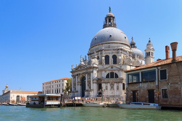 Fototapeta na wymiar VENICE, ITALY - July 25 2018: View on the Basilica di Santa Maria della Salute from the water