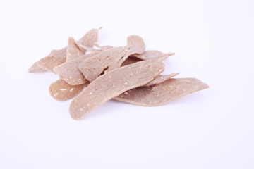 Home made raw fish cracker on white background.