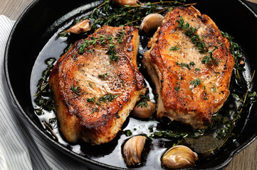 Roasted pork steak in frying pan