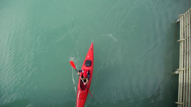 Aerial View of Kayaker Paddling on Turquoise Glacial Lake