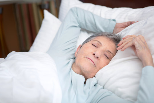 Elderly woman getting a good nights rest.