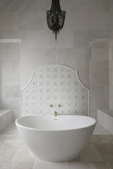 modern white tiled bathroom with bath and walk in shower