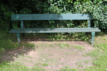Park seat in a shady corner