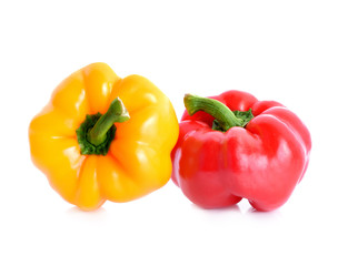 colored peppers over white background