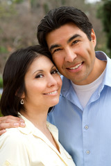 Happy Hispanic couple.