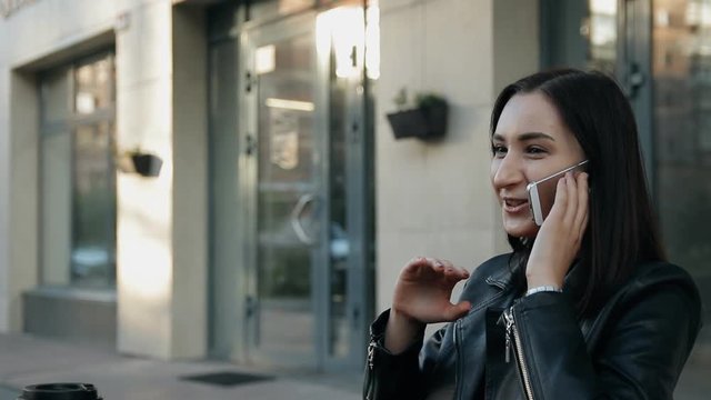 Young attractive woman talking on the phone.