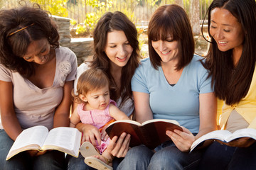 Diverse group of women talking and laughing.