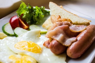 Fried eggs on a plate.