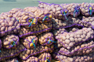 potatoes in bags of nets for sale folded for transportation
