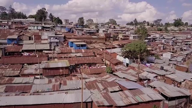 Remarkable aerial shot above vast overpopulated slums in Kibera, Nairobi, Kenya, Africa.