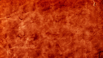 Antique texture, old grungy background and vintage parchment concept with grunge image of blank orange aged paper with dirty stained marks with copy space