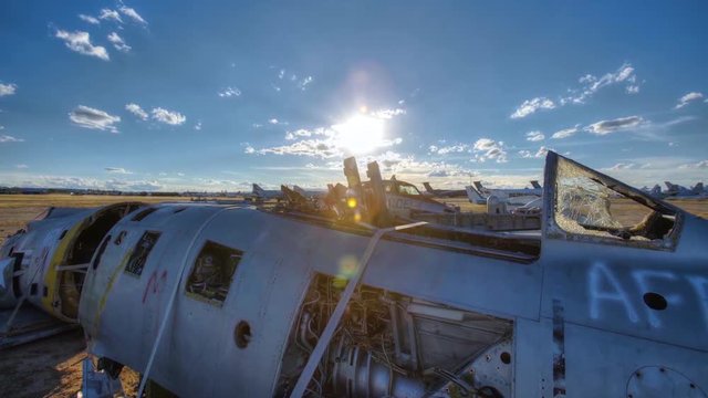 Great time lapse shots through a junkyard or boneyard of abandoned airplanes.
