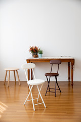 There are various funitures in the livingroom where has a large floor made of wood. Interior of here is bright and clean because of white color wall and good natural light.