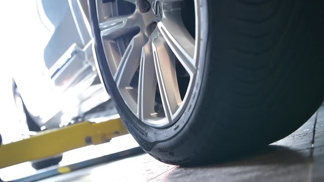Auto Service Lift Closeup Video. Lifting the Vehicle