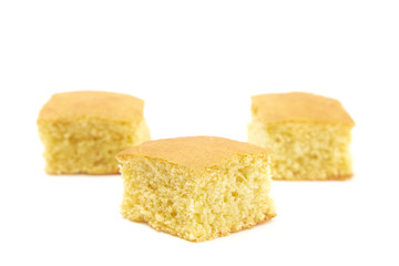 Square Cornbread Slices on a White Background