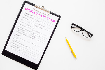 Unemployment claim form on white background top view