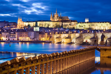 night view of Prague castle and Charles bridge over Moldau river, Lesser town, Prague (UNESCO),...