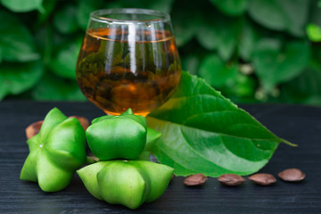 Sacha Inchi, fresh capsule seeds fruit of sacha-Inchi peanut with  tea 
