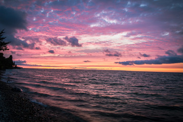 Beautiful Michigan Beach Sunset Background. Sunset along the shore of a Lake Huron beach in Cheboygan, Michigan.