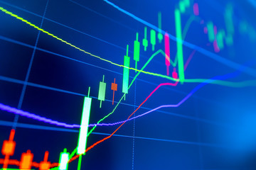 Stock market graph analysis. Stock market data on LED display on laptop screen for finance and economic. Business graph background.