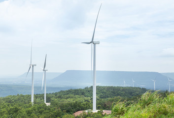 White wind turbines generating electricity in wind power station at Lam Takhong reservoir dam, Nakhon Ratchasima, Thailand