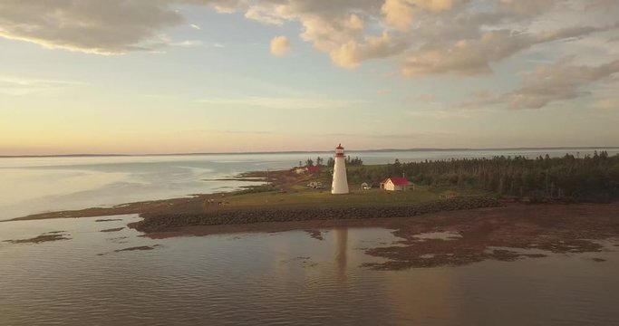Drone heading towards lighthouse wid