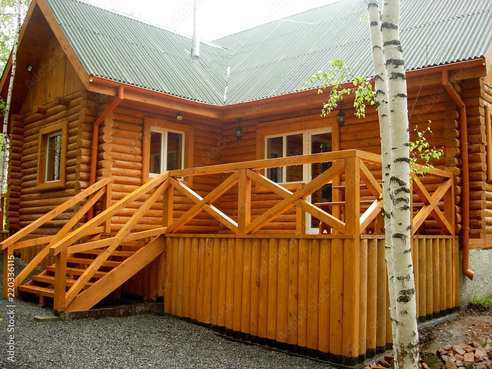 Wall mural wooden made house in the forest