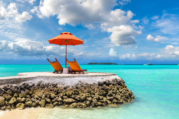 Sunbed and umbrella in the Maldives