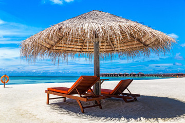 Sunbed and umbrella in the Maldives
