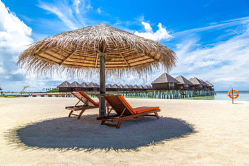 Sunbed and umbrella in the Maldives