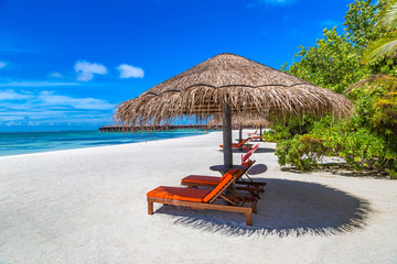 Sunbed and umbrella in the Maldives