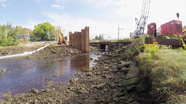 Construction of a cofferdam to keep the water level rising so a new bridge can be built
