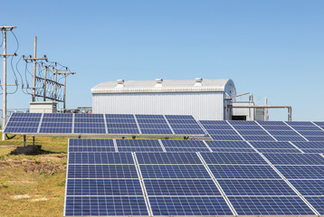 rows array of polycrystalline silicon solar cells or photovoltaics in solar power plant turn up...