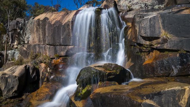 4k motion time lapse of a beautiful waterfall at a rocky canyon in Australia.