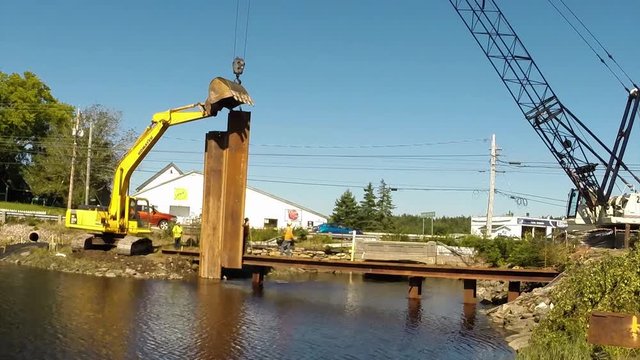 Construction of a cofferdam to keep the water level rising so a new bridge can be built