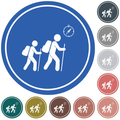 Hiking tourists with compass icon